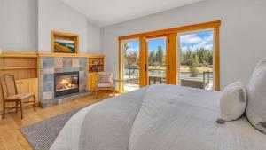 a bedroom with a bed and a fireplace at Pony Express 7 in Bend +98 photos