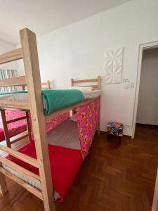 a bedroom with two bunk beds in a room at Savassi Hostel in Belo Horizonte