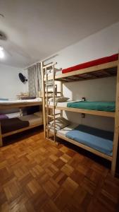 a room with several bunk beds in a room at Savassi Hostel in Belo Horizonte
