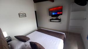 Katil atau katil-katil dalam bilik di Hotel boutique San Pablo