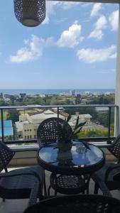 a table and chairs on a balcony with a view at Rental house Santo Domingo in Santo Domingo
