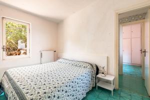 Ένα ή περισσότερα κρεβάτια σε δωμάτιο στο Amazing villa in a unique mediterranean island!