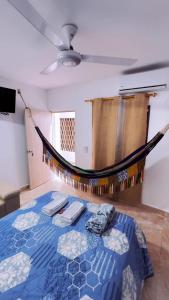 a room with a bed with a hammock in it at Hotel Luxury Plaza in San Jacinto