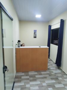 an office lobby with a reception desk in a room at Lucas e Bida in Imbau