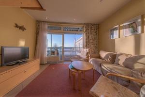 TV a/nebo společenská místnost v ubytování Eisvogel Classic 304