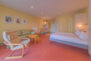 Un pat sau paturi într-o cameră la Strandläufer Classic 214 +11 fotografii