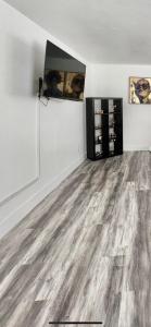 an empty living room with a wooden flooring at Cozy and Spacious Home in Las Vegas