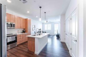 a large kitchen with a sink and a stove at Gateway to Old Town Scottsdale King 1 BR & Balcony in Scottsdale