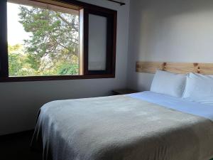 Ein Bett oder Betten in einem Zimmer der Unterkunft Villa Rural