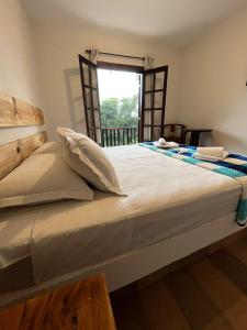 Ein Bett oder Betten in einem Zimmer der Unterkunft Villa Rural