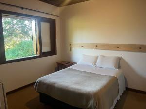 Ein Bett oder Betten in einem Zimmer der Unterkunft Villa Rural