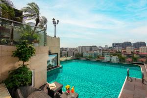 a swimming pool on the roof of a building at The Light Hotel in Hanoi