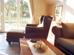 a living room with a couch and a coffee table at Wildgans 128 in Mirow