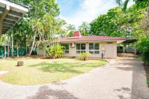 a small white house with a yard at Zenhouse Worker Accom-Trailer - Storage - Pets in Nightcliff