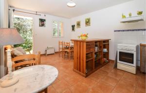 a kitchen and living room with a table and a table sidx sidx sidx at 2 Bedroom Lovely Home In Piscia Rossa in Afa