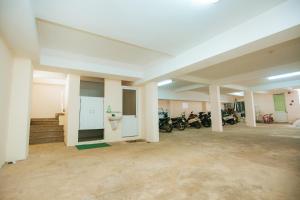 a large empty room with motorcycles parked in it at Phú Vang Hotel Pleiku in Pleiku +50 photos