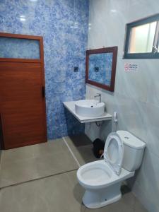 Ένα μπάνιο στο Mango Guesthouse