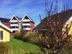 a group of houses in a yard with a house at Haubentaucher 80 in Rechlin