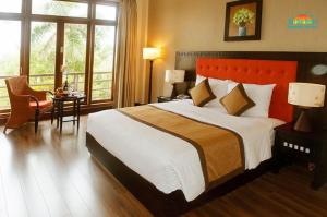 Ein Bett oder Betten in einem Zimmer der Unterkunft Sun Spa Resort & Villa