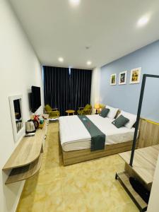 a bedroom with a large bed in a room at Like Hotel in Ho Chi Minh City +11 photos