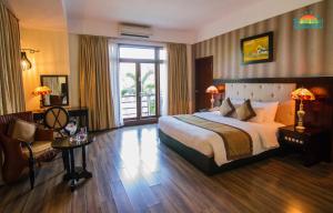 Ein Bett oder Betten in einem Zimmer der Unterkunft Sun Spa Resort & Villa
