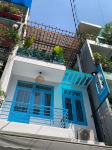 a blue and white house with a balcony at 1979 Homestay 1 in Hue