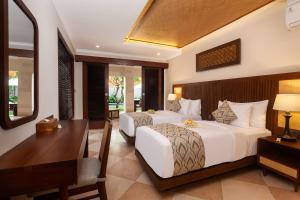 Postel nebo postele na pokoji v ubytování Ghana Villa Seminyak by Pramana Villas + 29 fotografií