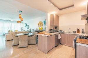 a kitchen and living room with a table and chairs at 4BR Luxury Tropical Paradise Close to the Ocean in Las Terrenas