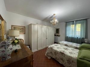 A bed or beds in a room at Appartamento in villa - Maria Grazia
