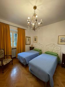 Voodi või voodid majutusasutuse Appartamento in villa - Maria Grazia toas