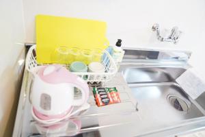 a refrigerator filled with dishes and utensils at 難波南52 in Osaka +62 photos