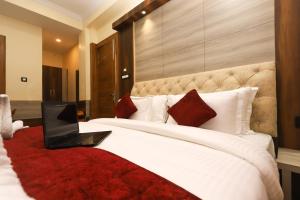 Voodi või voodid majutusasutuse Hotel Grand Nest toas