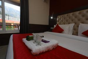 Voodi või voodid majutusasutuse Hotel Grand Nest toas