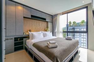 Postel nebo postele na pokoji v ubytování CityGate by Villacarte