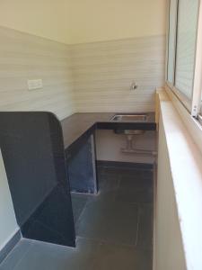 a bathroom with a sink in a room at Ashirwad Residency in Agonda