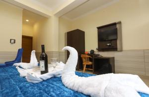 Voodi või voodid majutusasutuse Hotel Grand Nest toas