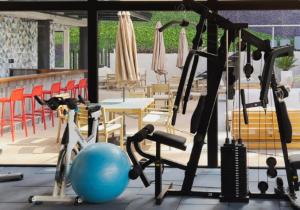 a gym with a gym ball and exercise equipment at Venecia 1BR Zona 10 Luxury Suite - Pool, Jacuzzi, Gym & View in Guatemala