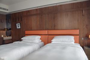 Postel nebo postele na pokoji v ubytování Sheraton Taitung Hotel