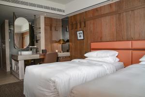 Postel nebo postele na pokoji v ubytování Sheraton Taitung Hotel
