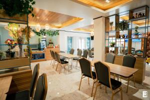 Restoranas ar kita vieta pavalgyti apgyvendinimo įstaigoje Bernese Resort Hotel powered by Cocotel