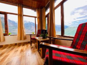 a living room with a view of a mountain at Varsha Guest House in Vapi