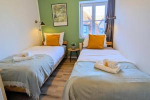 Postel nebo postele na pokoji v ubytování Uhlpartment - im Herzen von Salzwedel