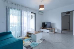TV a/nebo společenská místnost v ubytování Dunes