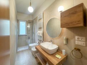a bathroom with a sink and a shower and a toilet at Tenuta dei Normanni in Salerno