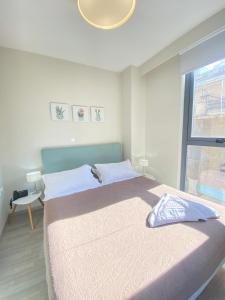 a bedroom with a large bed and a window at Tins Hotel City - Athens in Athens