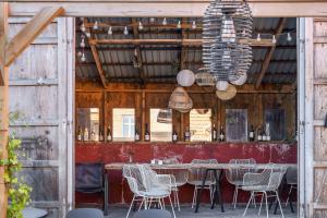 a dining room with a table and chairs at Lovely Apartment At Solgaarden 9 Årsdale in Svaneke