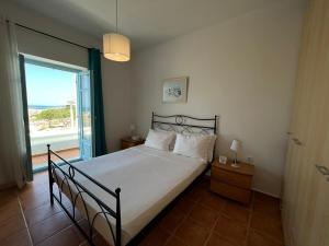 Postel nebo postele na pokoji v ubytování Mediterranean Blue Escape