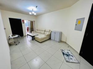 a living room with a couch and a table at Dubai gate 1, JLT Q cluster in Dubai
