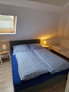 Кровать или кровати в номере Nordseeperle