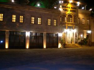 a large building at night with lights on it at Nature Park Cave Hotel in Goreme